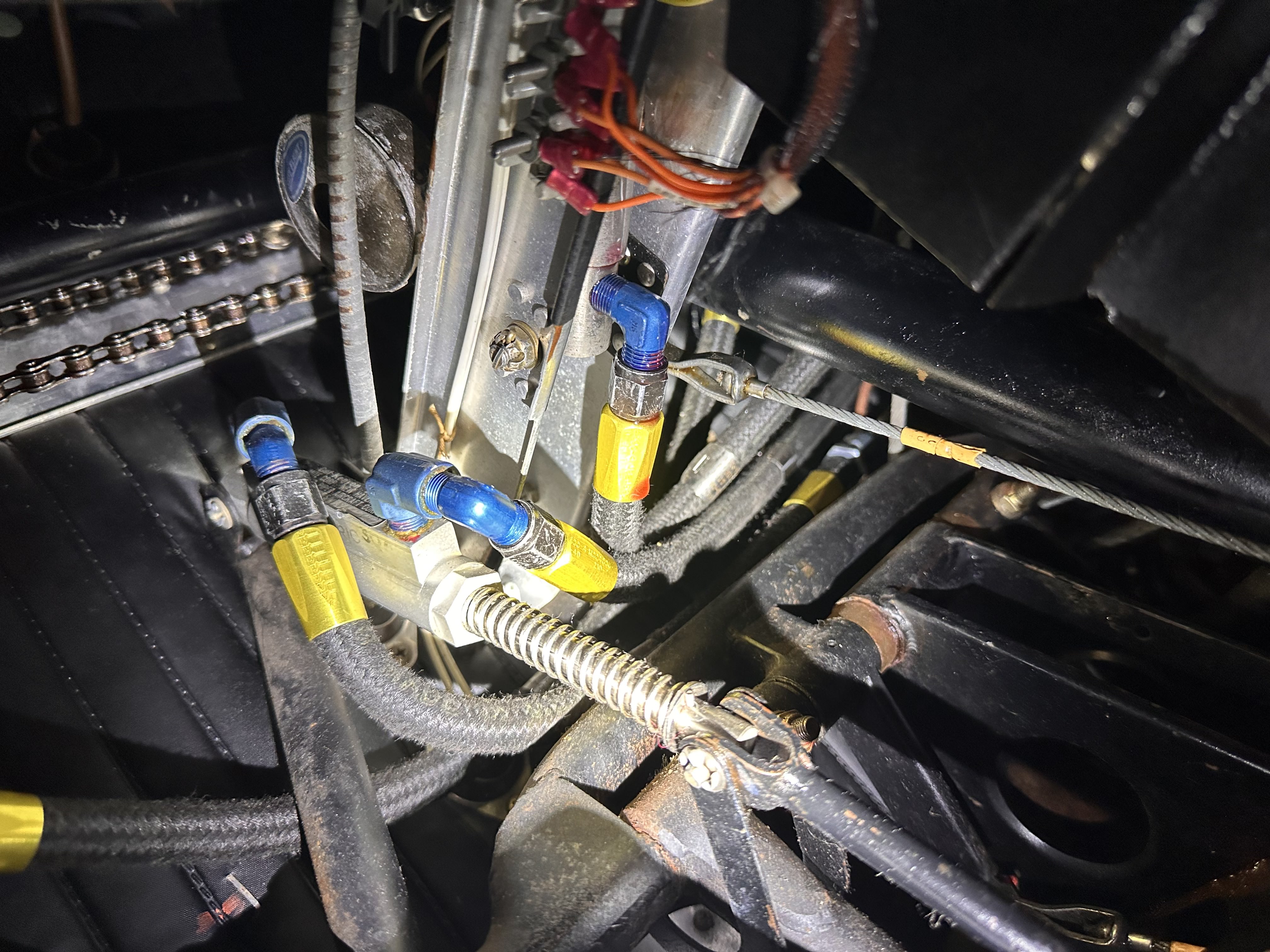 Engine bay fuel lines and fittings being serviced